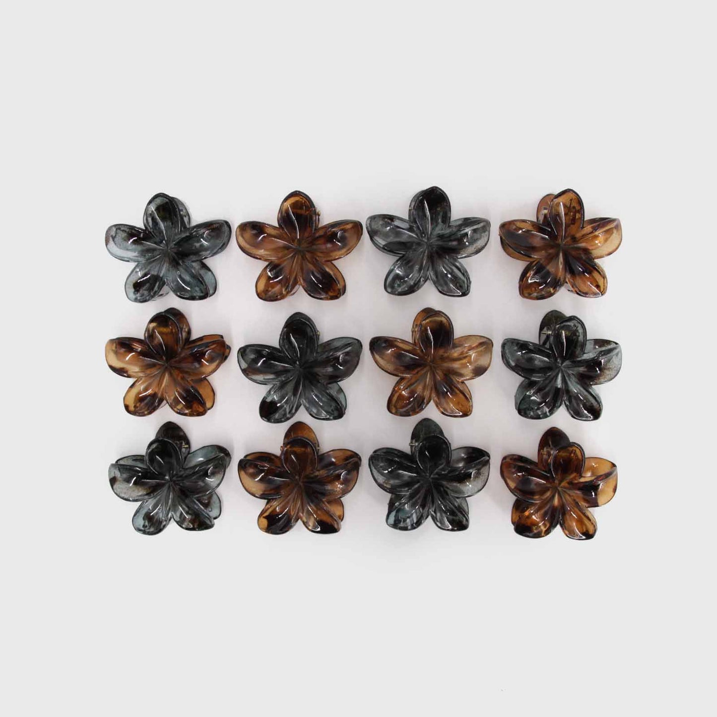 Clip para el cabello en forma de flor, disponible en gris y café | Urania Club