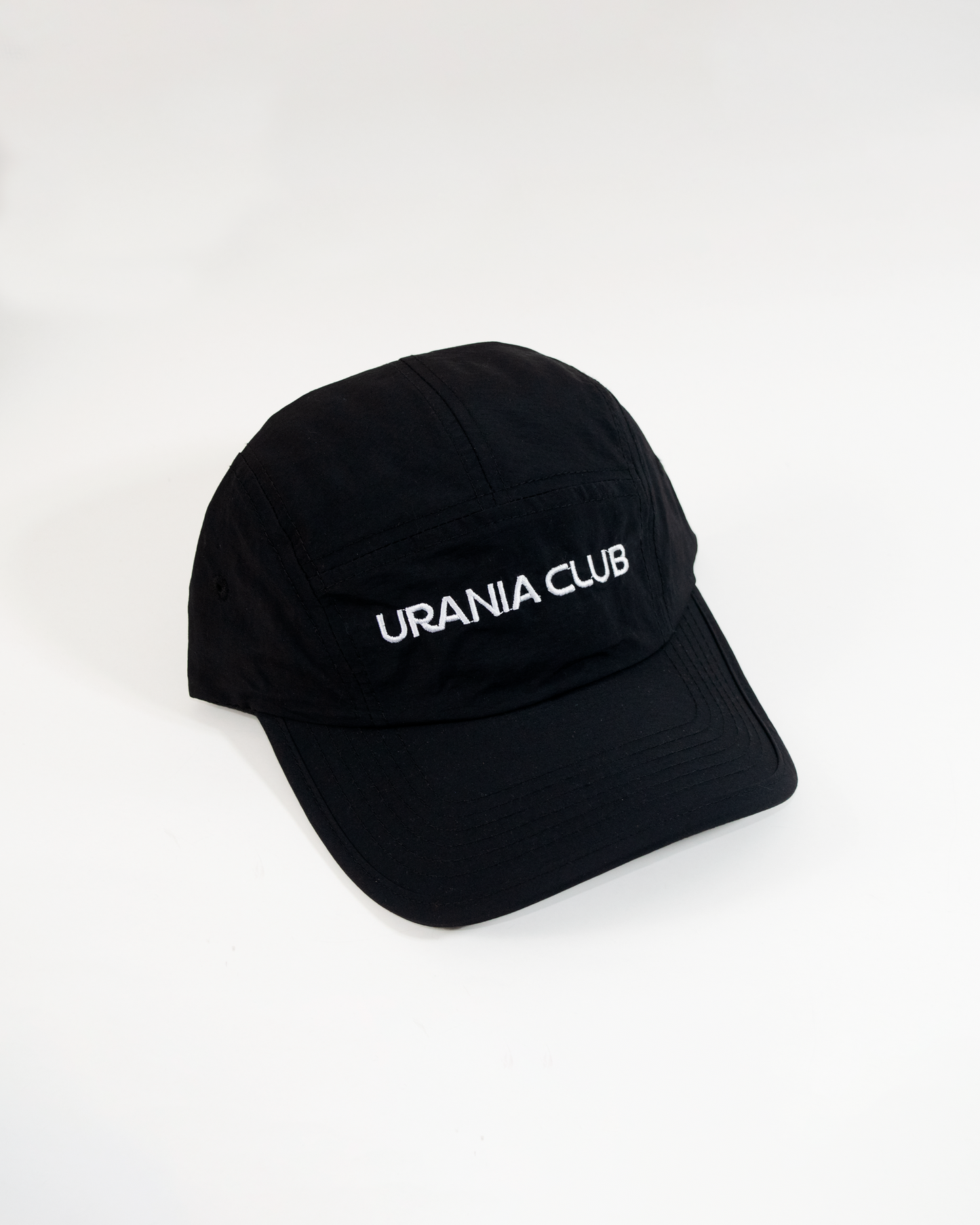 Gorra impermeable de 5 paneles con visera curva, fabricada en 100% nylon