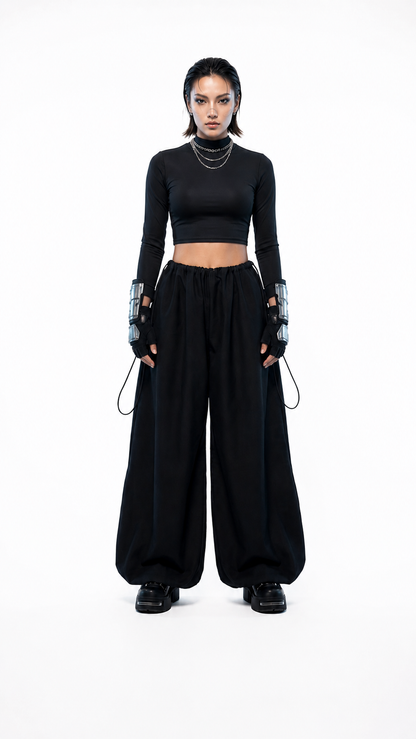 Pantalón oversized negro de inspiración techwear con tela Bristech, ajuste regulable y diseño artesanal - Urania Club